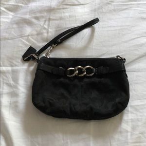 Black Coach wristlet with silver detail